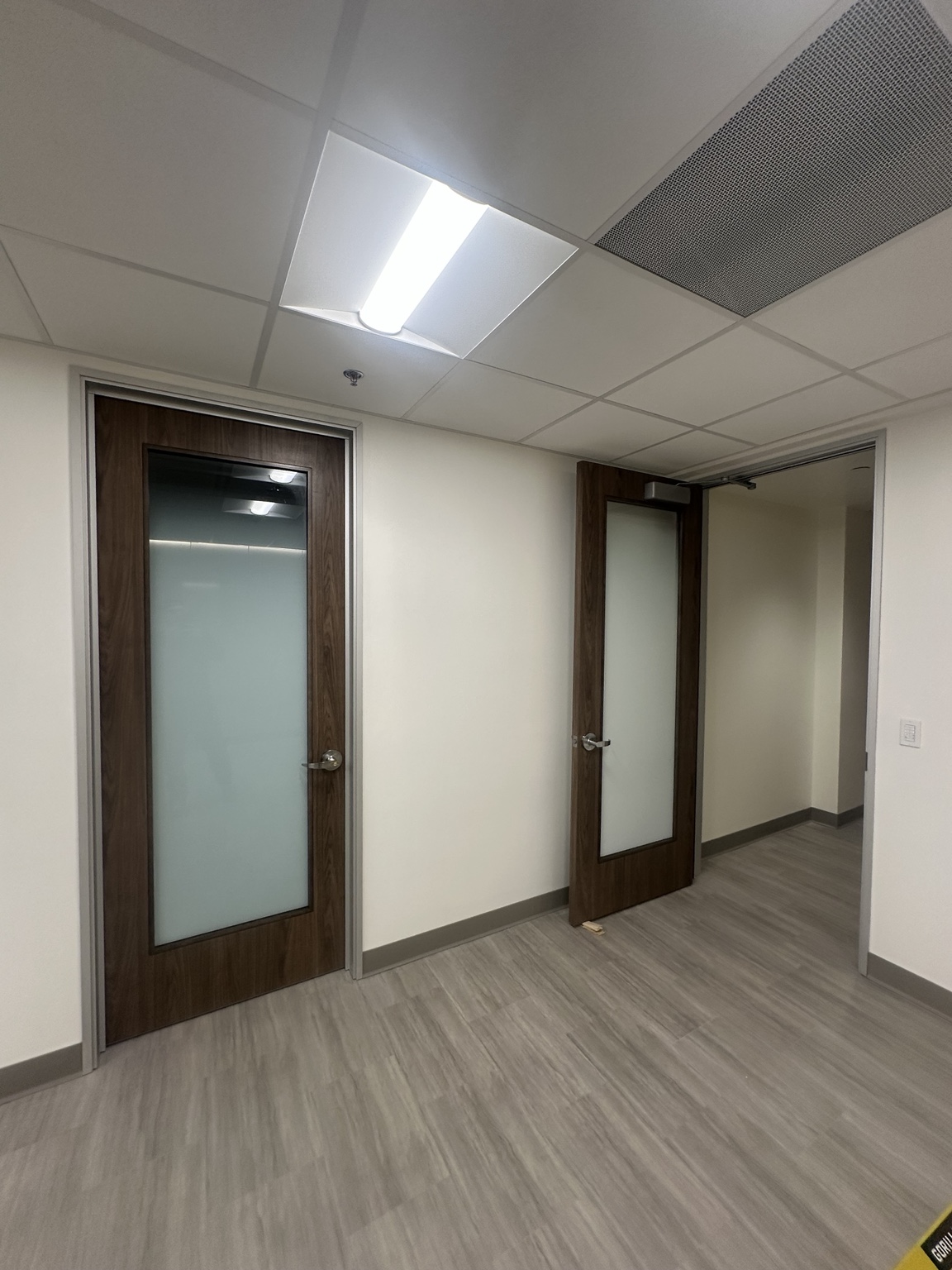 Commercial glazed doors with installed frames and hardware